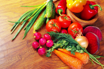 Appetizing vegetables on wooden table