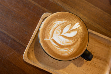 Latte coffee on a wooden table