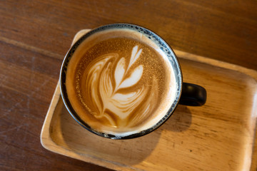 Latte coffee on a wooden table
