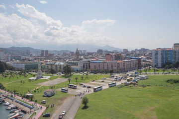 Sea And Modern Urban Architecture Skyscrapers. View From Ferris wheel Of Embankment Of The Georgian Resort