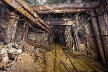 Fototapeta na wymiar Undeground gold mine tunnel drift with rails