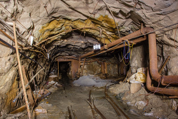 Undeground gold mine tunnel drift with rails