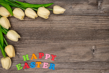 Beautiful tulips on wooden background
