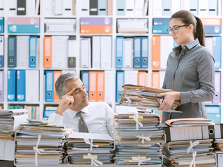 Business executive overloaded with work