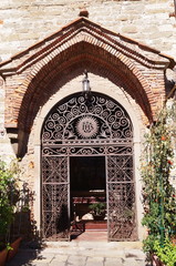 Fototapeta na wymiar Entrance to the church in Giusti square, Montecatini, Tuscany, Italy