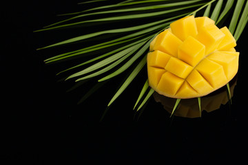 Peeled Pineapple on bamboo over black background