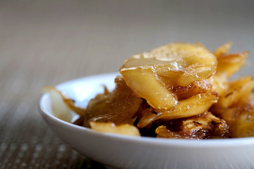 Sweet young coconut in sugar syrup in white dish, sweet dessert making from Thai local fruit, high sugar level that affect diabetes and  cause of many illness, and have space for write wording