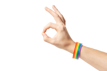Isolated hand gesture with rainbow gay pride bracelet