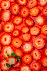 strawberry slice on red background. sliced strawberries
