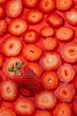 strawberry slice on red background. sliced strawberries