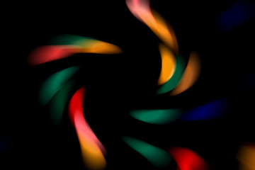 Blurred abstract background. Image of red, blue, green and yellow circles and wavy lines of different sizes.