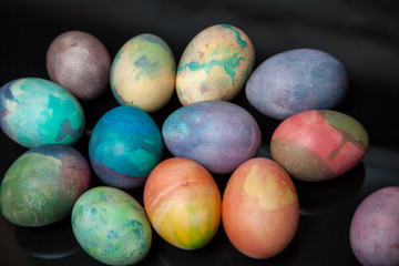 Group of easter painted eggs on black background