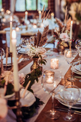 rustic wedding decorations with flowers and candles. banquet decor. picture with soft focus