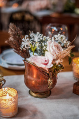 rustic wedding decorations with flowers and candles. banquet decor. picture with soft focus