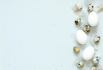 Easter composition with easter eggs and feathers, space for text - Image