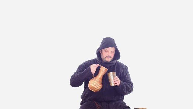 drunken medieval man in hoodie drinks vine white screen
