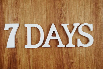 7 Days alphabet letter with space copy on wooden background