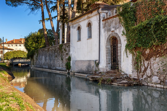 Canal and architecture in Udine city, Friuli Venezia Giulia region, Italy