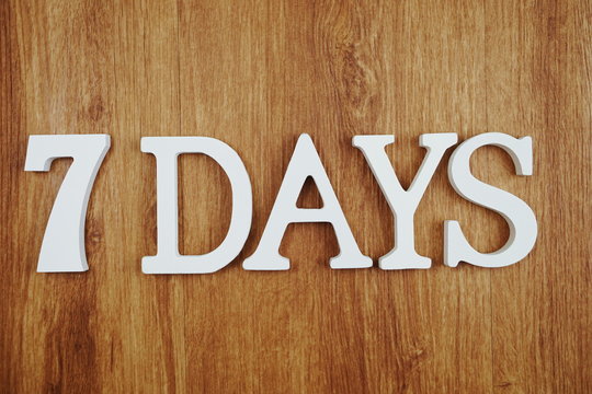 7 Days alphabet letter with space copy on wooden background