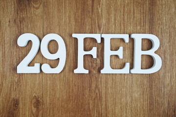 29 February alphabet letter with space copy on wooden background