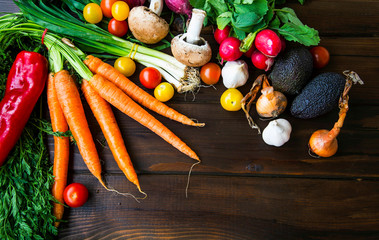 Healthy organic bio vegetables  with carrots, greens, onion, avocads, tomatoes, mushrooms, fresh green bio harvest