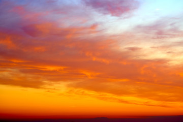 Naklejka na ściany i meble Colorful and dramatic sunset. Vivid abstract natural background.