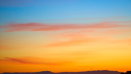 Colorful and dramatic sunset. Vivid abstract natural background.