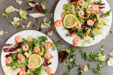 delicious shrimp with salad and lemon