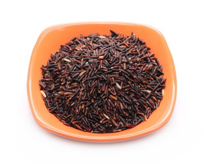 Wild black rice in bowl isolated on white background