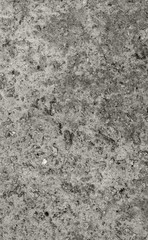 The texture of the old concrete wall with stones, cracks, dust, cracks, roughness. Texture, background