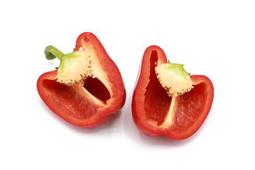 sliced half sweet red pepper - isolated on white