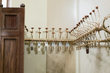 Naklejka premium Cloakrooms service in luxurious restaurant with number tags