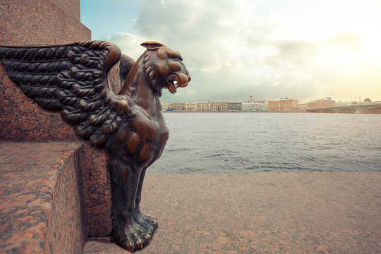 Sphinxes and Griphon in St. Petersburg. Panorama of Petersburg under a blue sky with clouds