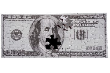 US dollar bill jigsaw isolated on white background; conceptual image, making money