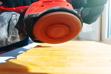 man with a grinding machine in his hands