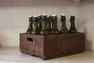 Vintage style bottle in wooden box, kitchen decoration