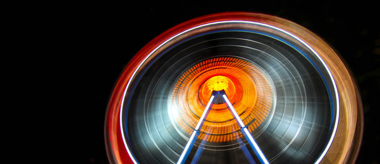 giant ferris wheel motion lights, munich oktoberfest - obrazy, fototapety, plakaty