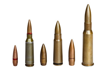 Cartridges and bullet of assault rifle and machine-gun of 7.62 caliber on white surface. Concept of weapon and military equipment.