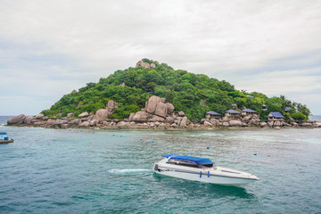 Speed boat sailing with island background in Koh Tao, Thailand