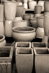 Many different plant pots in sepia color