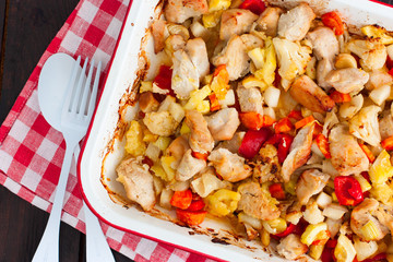 Baked vegetables with turkey fillet in the form, top view, selective focus