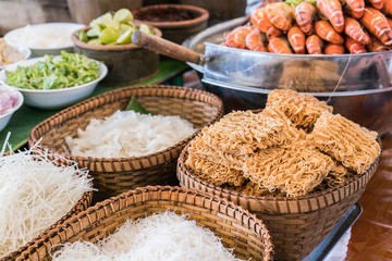 Thai street food instant noodle and other ingredient like shrimps in spicy hot street restaurant