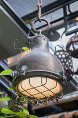 Vintage industrial styled lamps hanging from ceiling made from metal material