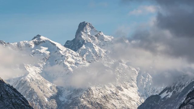 The Olan peak covered in fresh snow. Time-lapse. Valgaudemar Valley, Ecrins National Park, European Alps, France