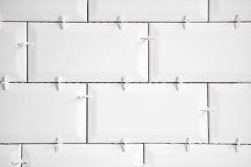 Ceramic tile lying. Installing new subway or metro tiles in bathroom, shower or kitchen back splash...