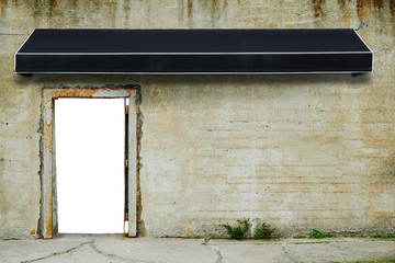 Awning on cement old rustic wall with blank door open