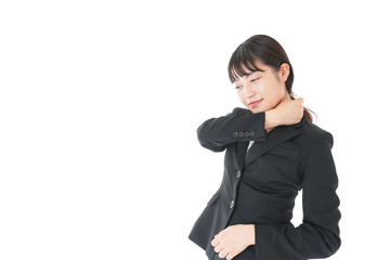 Obraz premium 肩こり・腰痛に苦しむ若いビジネスウーマン