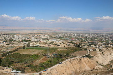 Fototapeta na wymiar Panoramic view on the Jericho valley from the Monastery Of The Temptation where Jesus resisted the temptations of Satan after fasting for 40 days in the desert In Jericho, Palestine