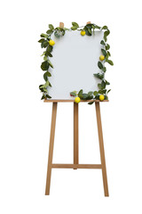 Blank canvas flip board with leaves and lemon decoration around white area isolated on white background