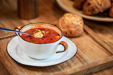 soup in a cup with buns